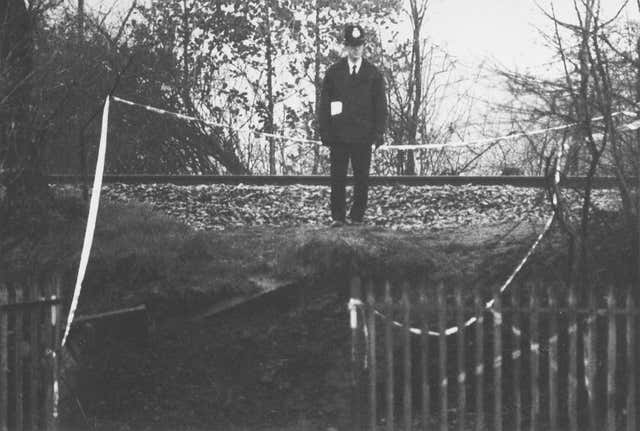 A policeman stands guard at the entrance of the site where the body of two-year-old James Bulger was found on a railway embankment in Liverpool in 1993 (PA)