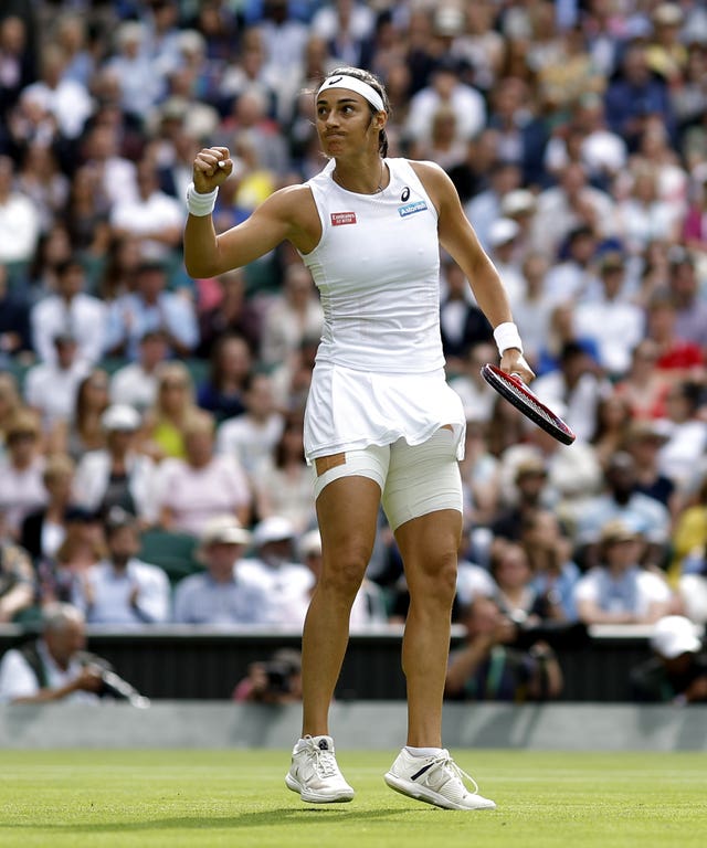 Caroline Garcia clenches her first after winning the first set