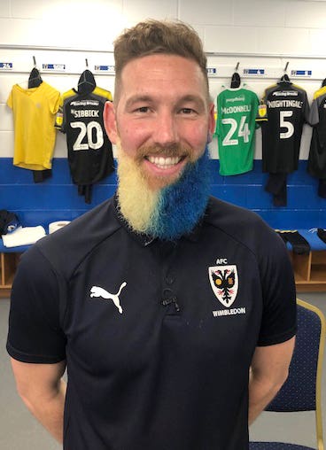 AFC Wimbledon midfielder Scott Wagstaff has had his beard dyed in blue and yellow in club colours
