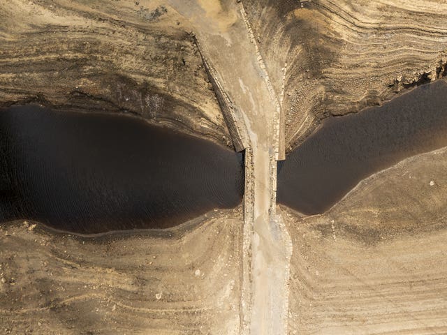 Dry cracked earth at reservoir
