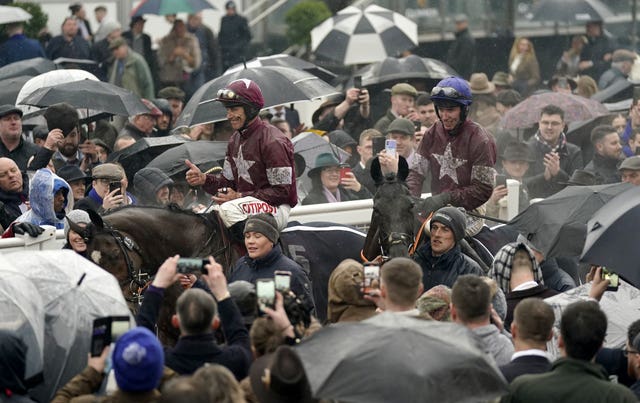 Jack Kennedy on Delta Work (right) walks back to the parade ring with Davy Russell and Tiger Roll