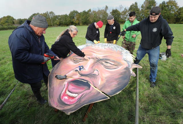 Volunteers put the finishing touches to Mr Bercow's head