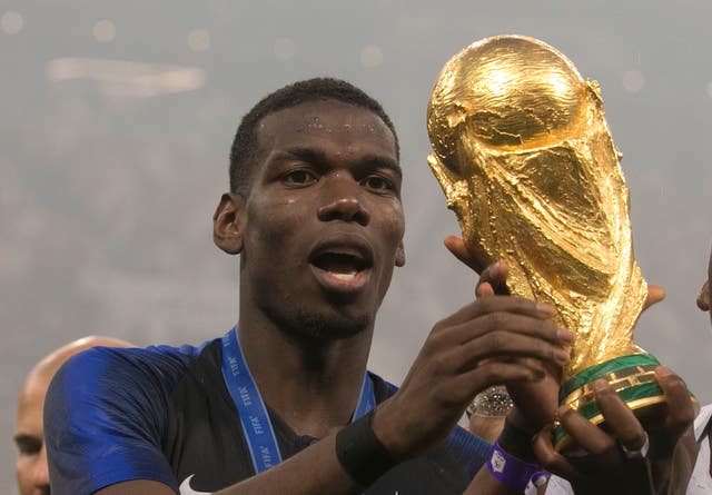 France's Paul Pogba celebrates with the World Cup won in Russia this summer