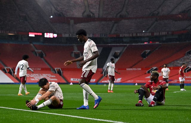 Paul Pogba, right, gave away the penalty with a foul on Hector Bellerin, left, 