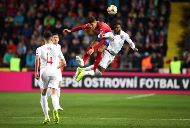 Danny Rose, right, challenges Patrik Schick for a high ball