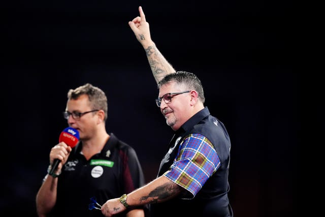 Gary Anderson celebrates winning his match against Adam Hunt