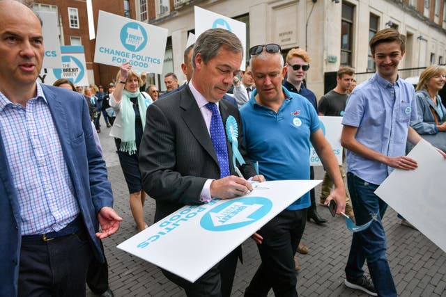 Nigel Farage on the campaign trail in Exeter (Ben Birchall/PA)