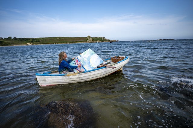 Powell paints in boats as she travels around the islands (Ben Birchall/PA)