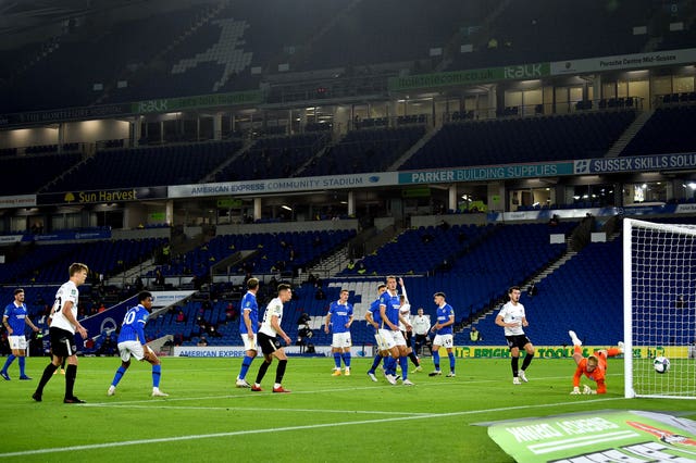 Portsmouth's Sean Raggett, second left, heads wide