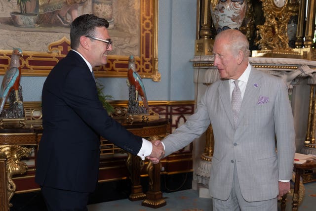 The King shakes hands with Andy Burnham