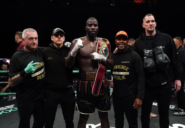 Lawrence Okolie (centre) and his team celebrate his title defence