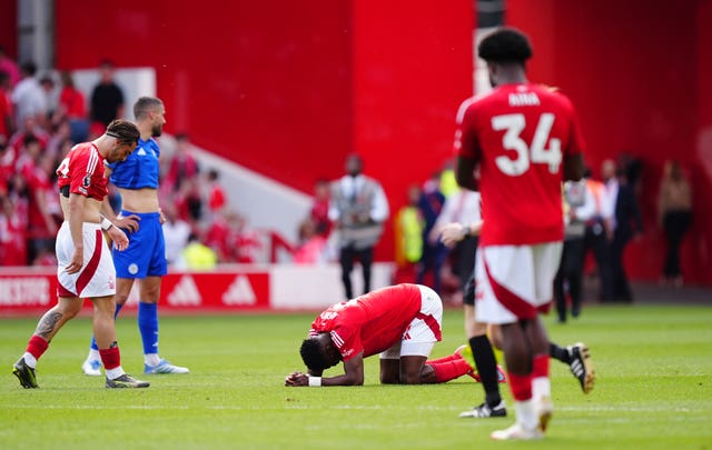 Taiwo Awoniyi, centre, lying down in pain