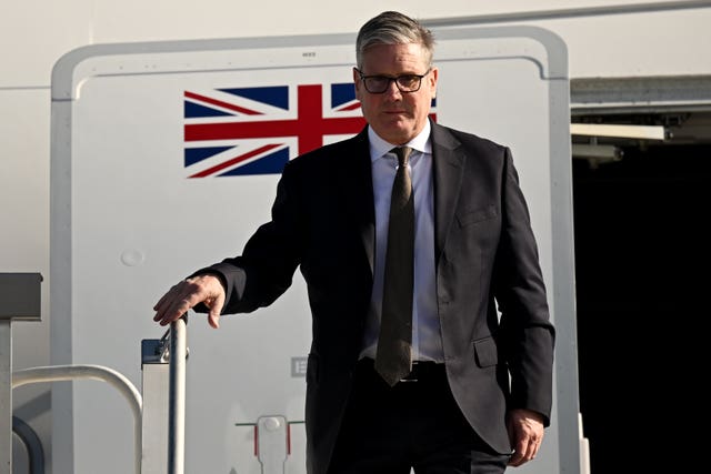 Sir Keir Starmer leaving an airplane