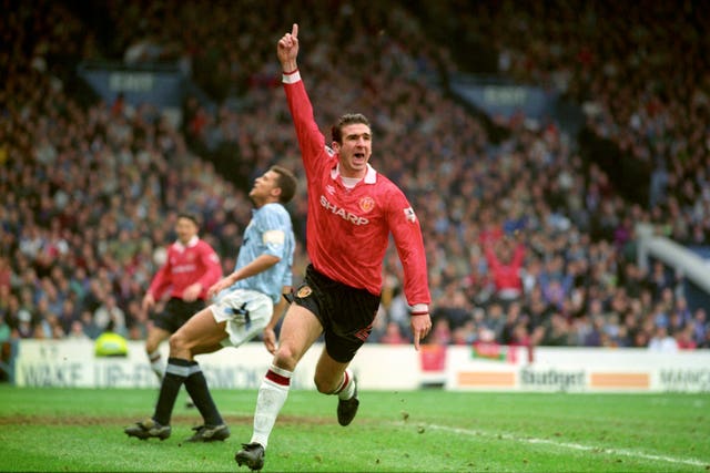Eric Cantona celebrates scoring for Manchester United