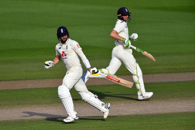 Jos Buttler (right) and Chris Woakes (left) are currently in quarantine.