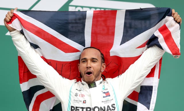 Lewis Hamilton celebrates winning a sixth British Grand Prix
