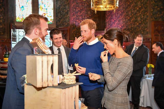 Prince Harry and Meghan Markle taste traditional Welsh cakes (Ben Birchall/PA)