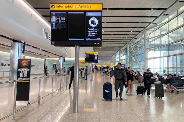 People in Terminal 2 arrivals at London Heathrow Airport (Kirsty O'Connor/PA)