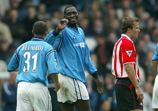 Marc-Vivien Foe, centre, celebrates scoring for Manchester City