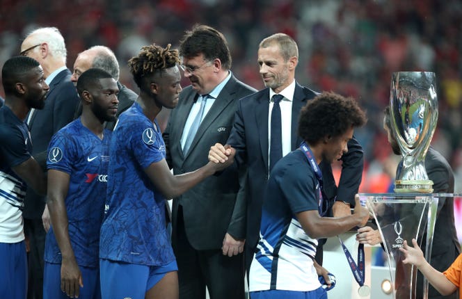 Tammy Abraham shakes hands with UEFA chairman Aleksander Ceferin
