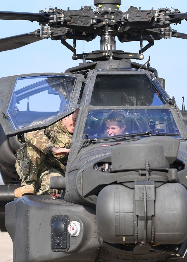 Defence Secretary Gavin Williamson in the cockpit of an Apache helicopter at Wattisham Airfield in Suffolk