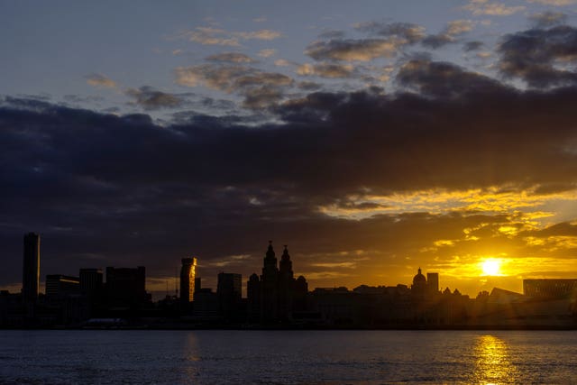 Sun rise against Liverpool skyline