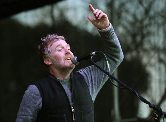 Glen Hansard sings to the crowd at the Right2Water anti water charges protest, outside Leinster House in Dublin