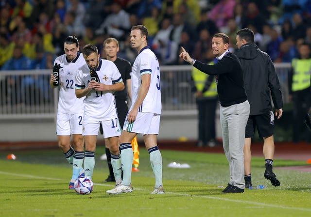 Ian Baraclough, right, instructs his players during June's defeat to Kosovo