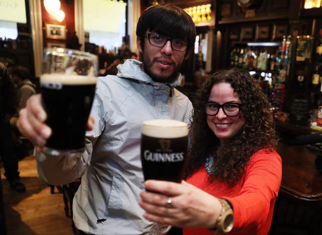 Students Juan Pizarro, from Chile, and Yadira Perez, from Mexico, enjoying a drink (Brian Lawless/PA)