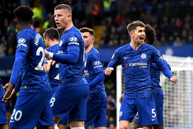 Chelsea’s Jorginho, right, celebrates scoring from the penalty spot 