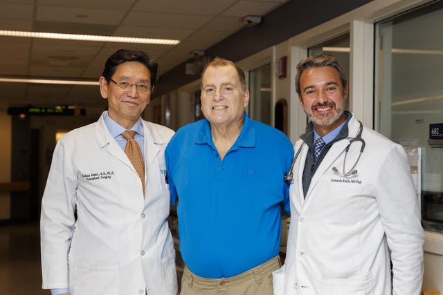 Patient flanked by two doctors