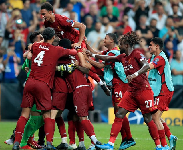 Liverpool goalkeeper Adrian is mobbed by his Liverpool team-mates on Wednesday