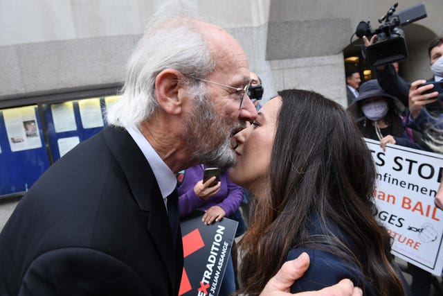 John Shipton, the father of Wikileaks founder Julian Assange, hugs Stella Moris (Stefan Rousseau/PA)