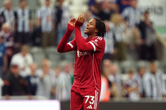 Rio Ngumoha applauds the Liverpool fans after the team's win at Newcastle