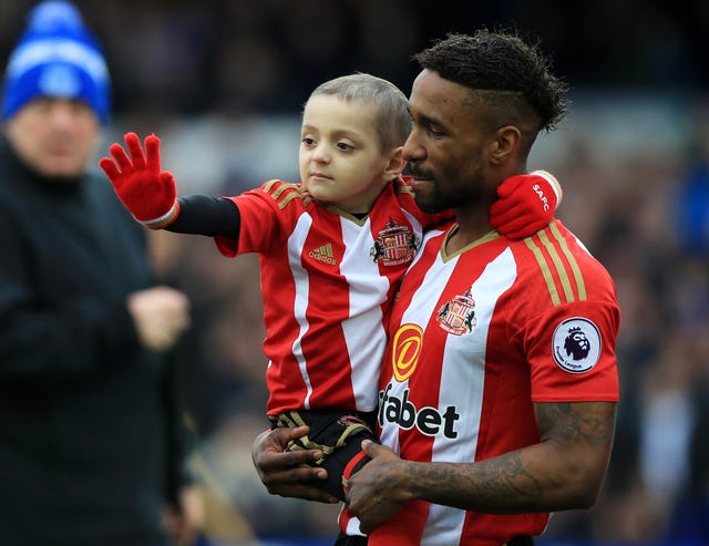 Jermain Defoe, here pictured with Bradley Lowery, who died in 2017 aged six, has been honoured with an OBE for services to charity