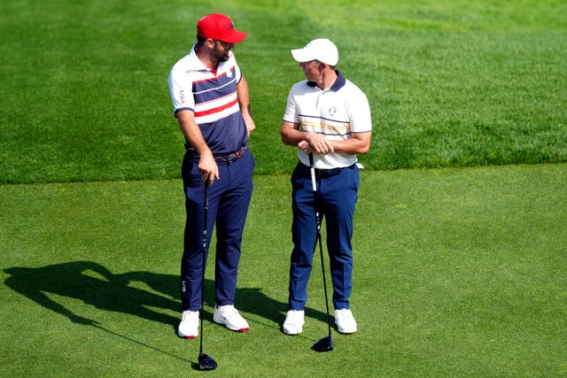 Scottie Scheffler speaks to Rory McIlroy