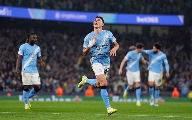 Manchester City’s Phil Foden celebrates scoring against Borussia Dortmund