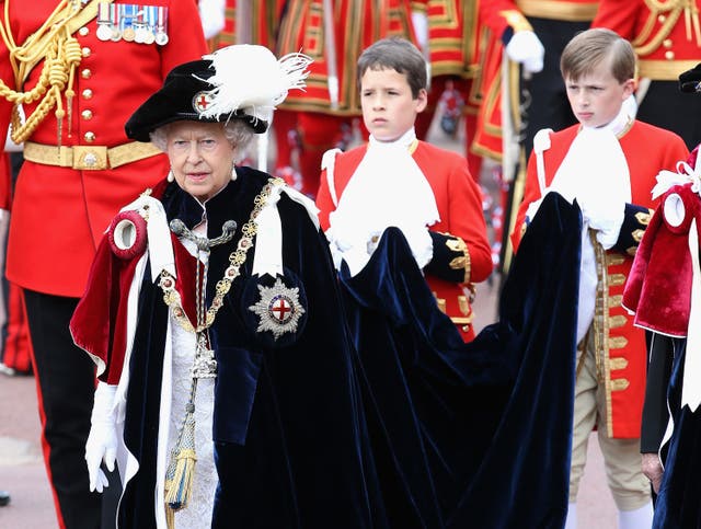 The Queen wearing her Garter badge decorated with the St George's flag at at St George’s Chapel, Windsor Castle (Chris Jackson/PA)
