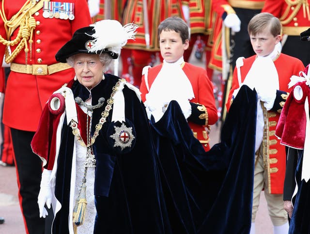 The Queen wearing her Garter badge decorated with the St George's flag at at St George's Chapel, Windsor Castle (Chris Jackson/PA)