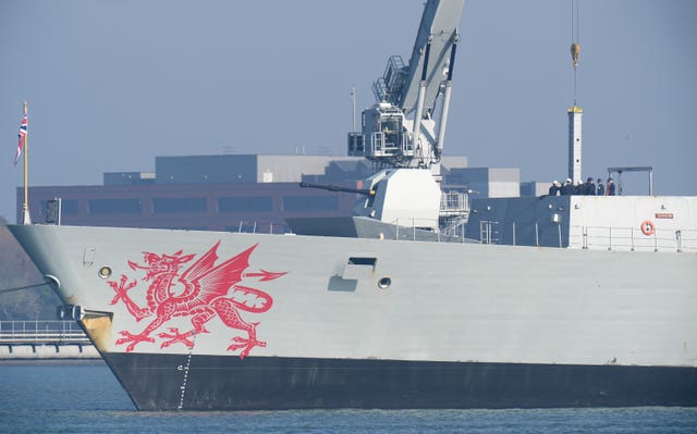 Equipment is brought on board the Royal Navy Type 45 destroyer HMS Dragon at Portsmouth harbour, Hampshire