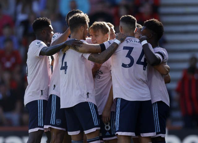 Martin Odegaard (centre) celebrates with his team-mates