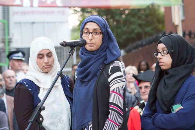 Ruzina Akhtar (centre) daughter of Makram Ali, who was killed in the attack, makes a speech 