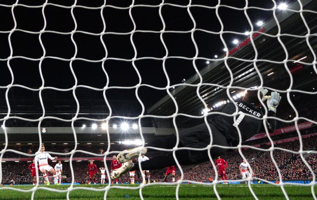 Alisson Becker saves a penalty