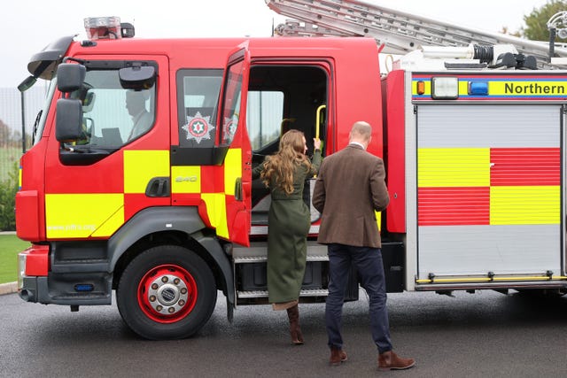 The Princess of Wales climbs into a fire engine