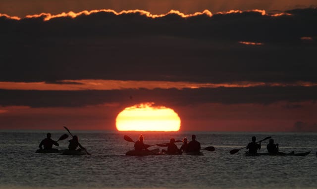 Kayakers watch dawn break in North Tyneside