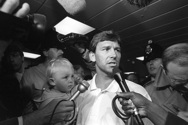 Robson, with his son Ben, talks to the media at Manchester Airport after Italia '90