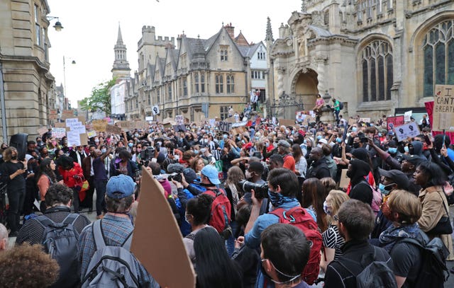 Protesters call for the removal of the statue of Cecil Rhodes