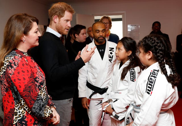 Harry meets participants in a jiu-jitsu session