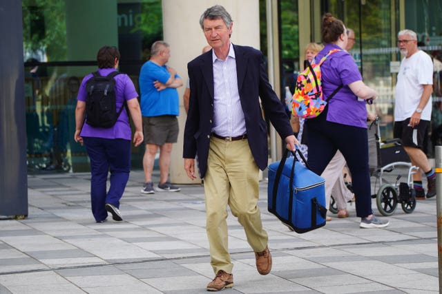 Vice Admiral Sir Tim Laurence leaves Southmead Hospital after visiting his wife the Princess Royal