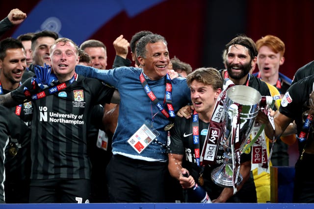 Northampton boss Keith Curle celebrated the first promotion of his managerial career